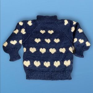 Blue sweater with white hearts